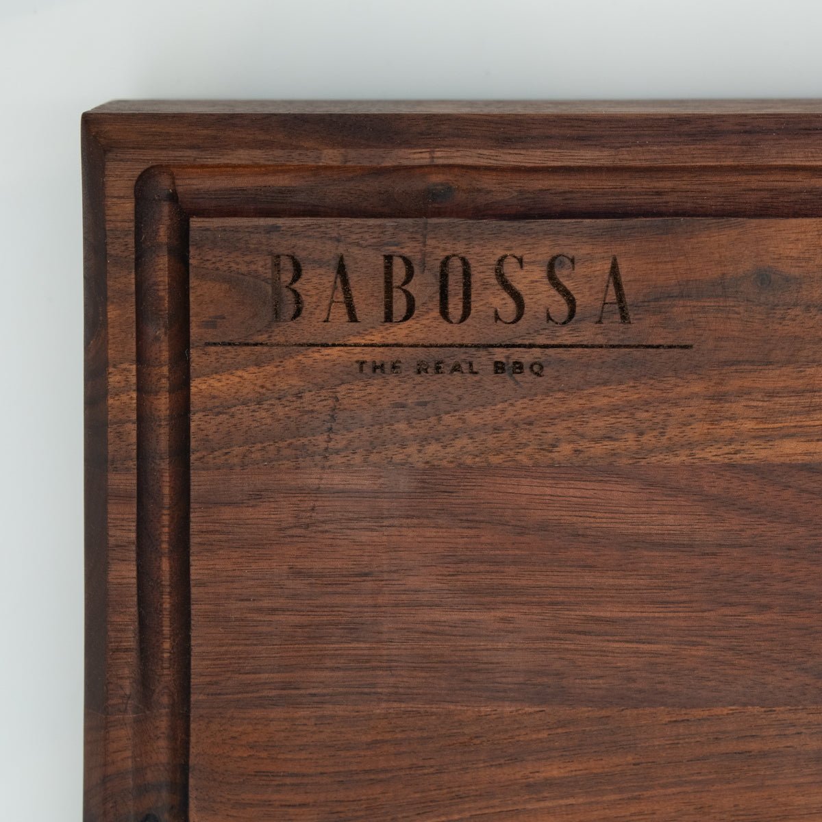 BABOSSA | Nussbaum Schneidebrett XL | Naturkante | Saftrille | 70x40x6 cm - grillstarshop.comBABOSSA | Nussbaum Schneidebrett XL | Naturkante | Saftrille | 70x40x6 cmHolzbrettBABOSSAgrillstarshop.com