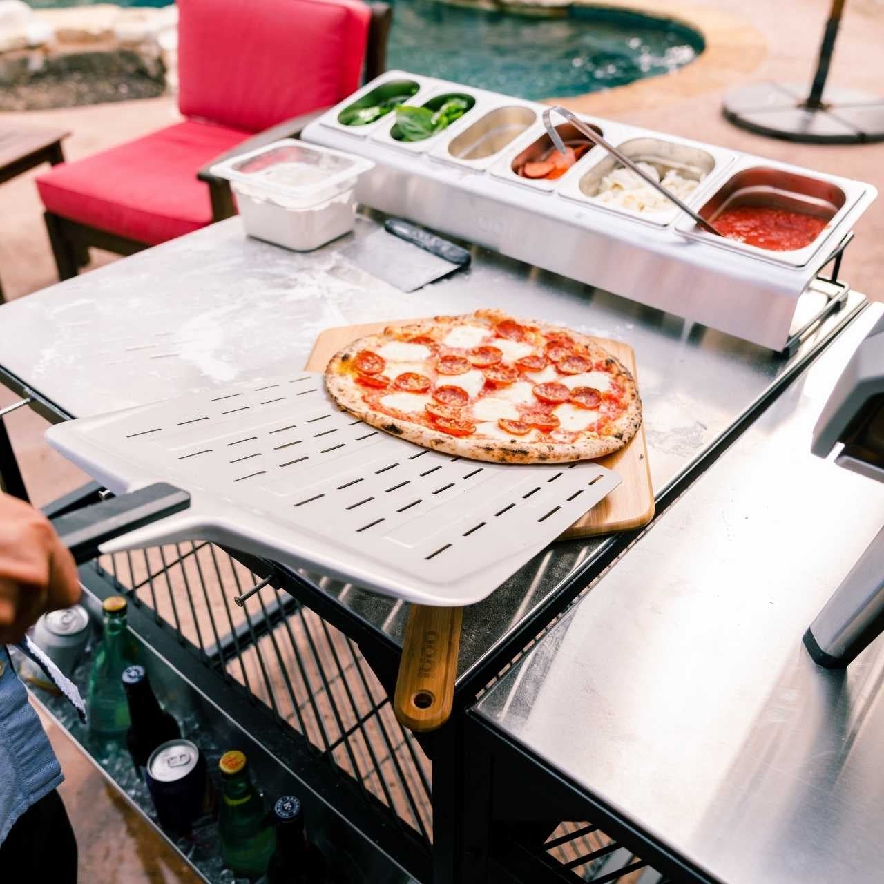 Ooni Perforierte Pizzaschaufel - 30 cm - grillstarshop.comOoni Perforierte Pizzaschaufel - 30 cmOonigrillstarshop.comUU - P064015060568341132