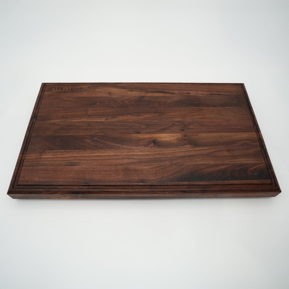 BABOSSA | Nussbaum Schneidebrett XL | Naturkante | Saftrille | 70x40x6 cm - grillstarshop.comBABOSSA | Nussbaum Schneidebrett XL | Naturkante | Saftrille | 70x40x6 cmHolzbrettBABOSSAgrillstarshop.com