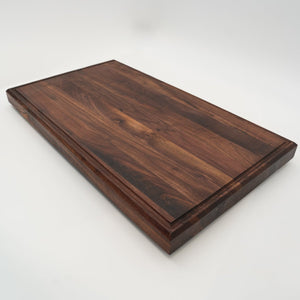 BABOSSA | Nussbaum Schneidebrett XL | Naturkante | Saftrille | 70x40x6 cm - grillstarshop.comBABOSSA | Nussbaum Schneidebrett XL | Naturkante | Saftrille | 70x40x6 cmHolzbrettBABOSSAgrillstarshop.com